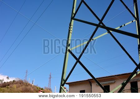 Electrical tower on a background of the blue sky
