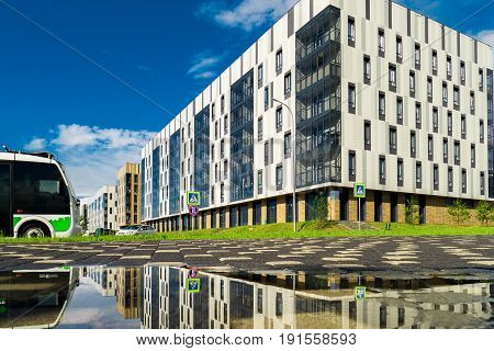 Buildings of white color created in a contemporary style. the bottom grass and trees. The building housing the city's University Innopolis, Kazan