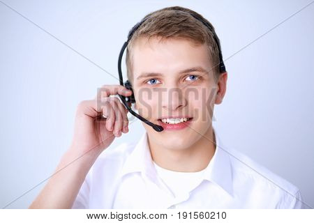 Call center male operator on gray background