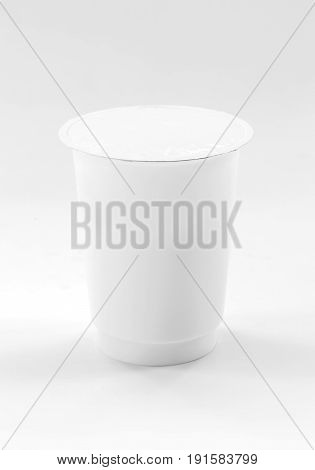 blank packaging white plastic cup for yogurt dairy product on white background with clipping path