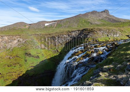 Iceland Landscape With Small Waterfall Among Green Hills. Beautiful Scenery In Saefellsnes Peninsula
