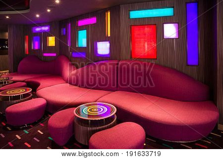 Cruise liner Splendida - May 30, 2017: Red sofa in bar modern interior on cruise liner Splendida.