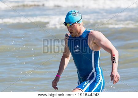 Pescara Italy - June 18 2017: Arrival of the first athletes at the end of the swimming test at Ironman 70.3 in Pescara