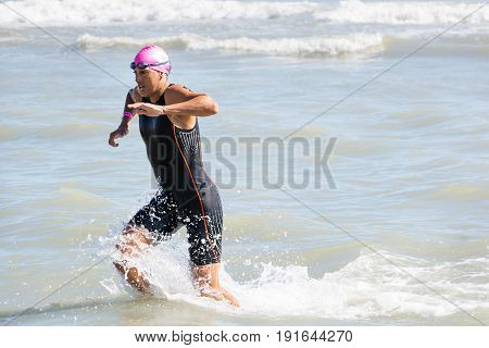 Pescara Italy - June 18 2017: Arrival of the first athletes at the end of the swimming test at Ironman 70.3 in Pescara