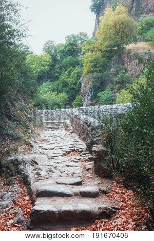 Footpath leading to the The Pont du Diable or Devil Bridge ia Roman bridge that spans the river Ardeche at about 10m altitude. The bridge is located near the village of Thueyts in the Ardeche department in France