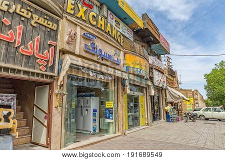 YAZD, IRAN - MAY 5, 2015: Shops on Kashani Rd in front of the fire temple Atash Behram in old city.