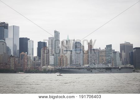 USS Kearsarge (LHD 3) passes Lower Manhattan WTC Financial District on the Hudson River during the Parade of Ships at the start of Fleet Week New York, JERSEY CITY NJ MAY 24 2017.
