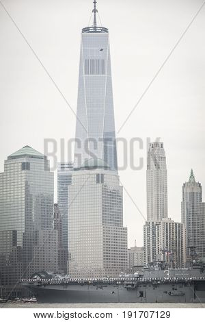 USS Kearsarge (LHD 3) passes the Freedom Tower and World Trade Center Financial District during the Parade of Ships marking the start of Fleet Week New York, JERSEY CITY NJ MAY 24 2017.