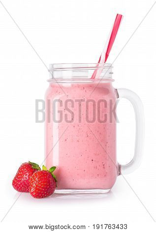 strawberry smoothie with straw in mason jar and fresh ripe strawberries near isolated on white background. Pink milkshake. Healthy drink