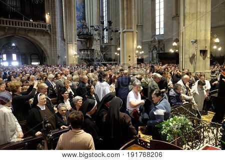 ZAGREB, CROATIA - APRIL 14: Worshippers gather to look at the relics of St. Leopold Mandic in Zagreb cathedral, Zagreb, Croatia on April 14, 2016.