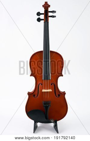 Violin with bow isolated on white background. Classical stringed musical instrument fiddle with fiddlestick.