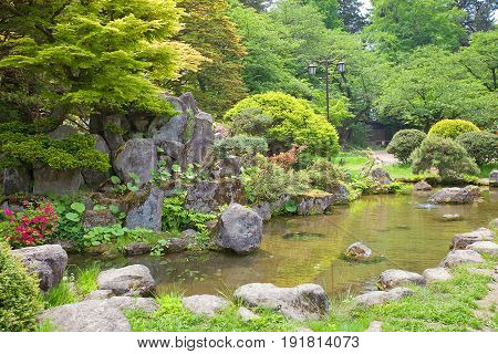 HIROSAKI JAPAN - MAY 23 2017: Traditional Japanese garden on the grounds of Hirosaki Castle Japan. Castle was erected in 1611 by Tsugaru Nobuhira designated National Historic Site in 1952