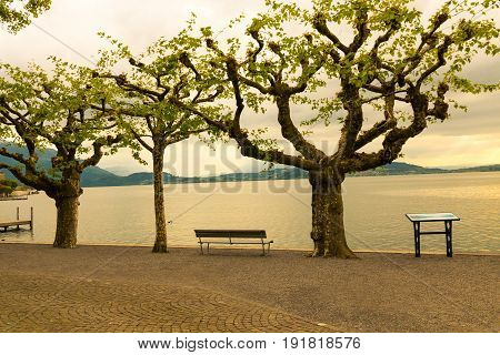 Sunset on lake Zug Switzerland. View from promenade of Zug city.