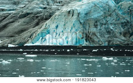 Glacier ice takes on a blue color in the sunshine
