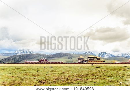 Gyergo monastery and Mount Yala by tagong grassland in Sichuan province