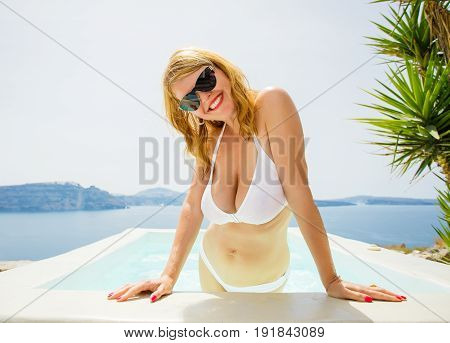 Woman in white bikini enjoying the summer.