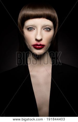 Fashion vintage portrait of beautiful young woman with brows and stylish make-up