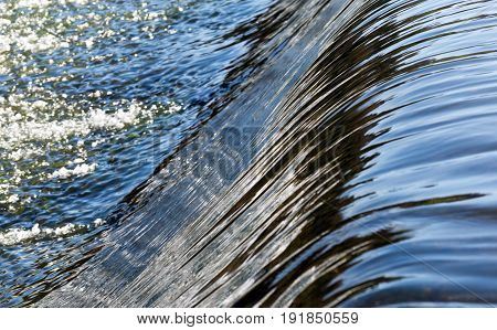 Close up Water flowing from the dam