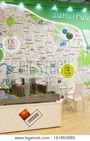 MOSCOW - MAR 16, 2017: Stand of Donstroy company with map at real estate exhibition in Central House of Artists, 200 companies took part in exhibition