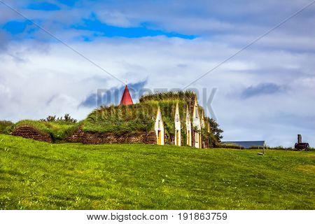 The picturesque village of old houses covered with turf and grass. The concept of the historical and cultural tourism