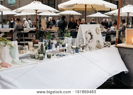 Copenhagen Denmark - August 11 2016. People in antiques and artisans street market in Frue Square in Copenhagen. Frue Plads is a public square located on the north side of the Church of Our Lady in central Copenhagen