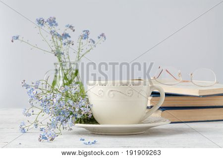 Forget-me-nots Flowers On Book, On Wooden Background