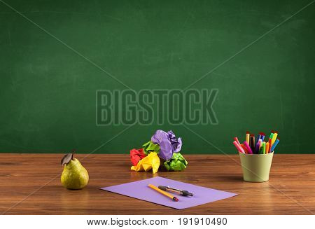 Back to school concepty with clear blackboard background, desk, items