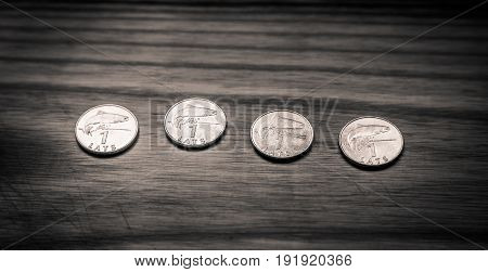 Old Latvian coins on a wooden backgrouns. Lats and centimes.