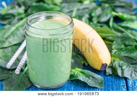 Detox green smoothie with spinach pineapple banana and yogurt horizontal