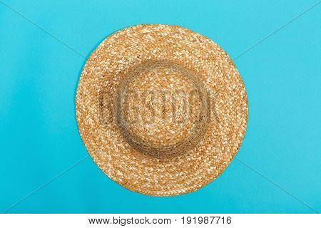 Staw hat on a bright blue background