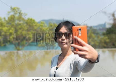 traveling Asian woman at the outdoor in daytime