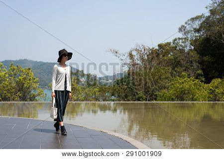 traveling Asian woman at the outdoor in daytime