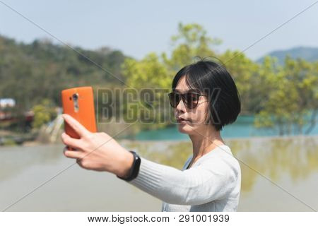 traveling Asian woman at the outdoor in daytime