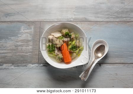 Chicken Soup With Matzah Balls (kneidlach) Carrots In The Bowl. Jewish Traditional Passover Pesach H
