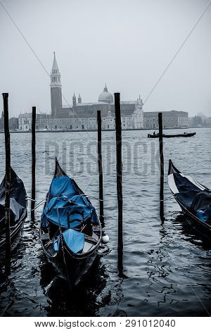 Venice / Italy 19 February 2019 :gondols ,the Symbol Of Venice , Parked In The Canal