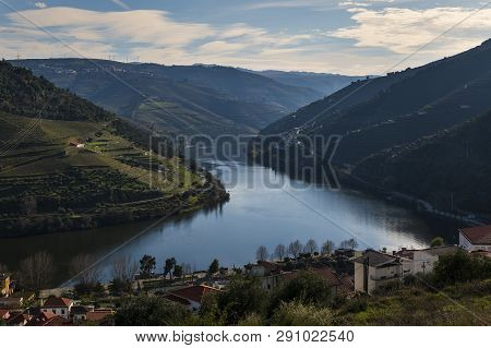 View Of The Pinhao Village With Terraced Vineyards And The Douro River, In Portugal; Concept For Tra