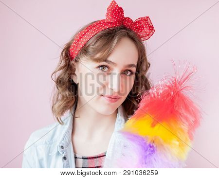 Cleaning Pin Up Woman. Smiling Pinup Girl Holds Colorful Duster Brush. Cleaning Service. Pin-up Girl