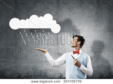 Horizontal Shot Of Confident And Young Businessman In Smart-casual Wear Smoking Pipe While Standing 