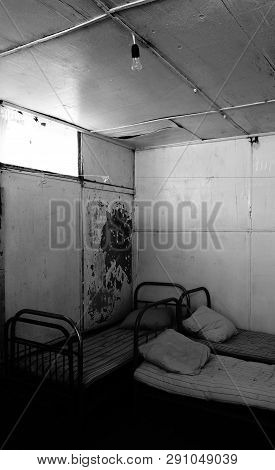 Abandoned Room With Beds And Dirty Mattresses