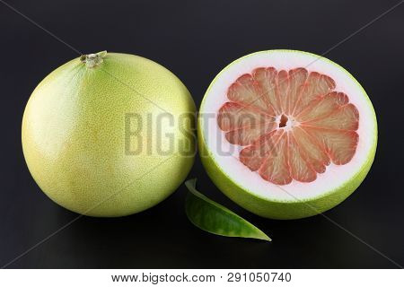 Organic Pummelo On Black Background. Close Up