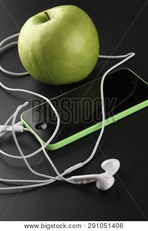 Tambov, Russian Federation - October 16, 2013 Apple Iphone 5c Green Color, Apple Earpods And Green A