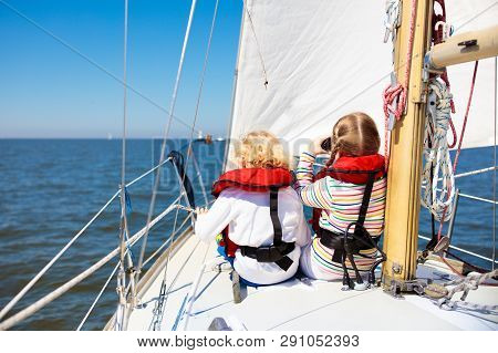 Kids Sail On Yacht In Sea. Child Sailing On Boat.
