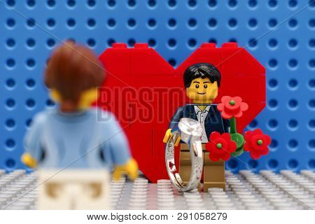 Tambov, Russian Federation - September 03, 2015 Lego Man Minifigure With Ring And Flowers Meeting Hi