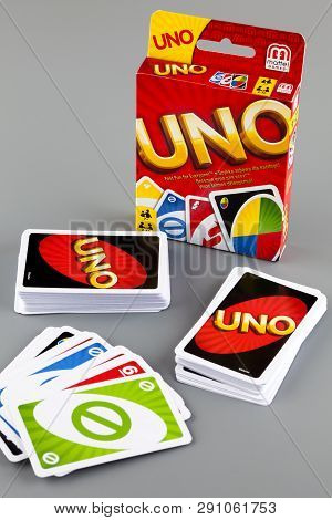 Tambov, Russian Federation - August 15, 2013 Decks Of Uno Game Cards And Uno Game Box On Gray Backgr
