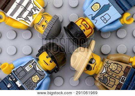 Tambov, Russian Federation - May 12, 2016 Three Lego Policemen And One Criminal Minifigures On Lego 
