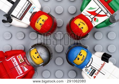 Tambov, Russian Federation - July 06, 2016 Four Lego Driver Minifigures On Lego Gray Baseplate Backg