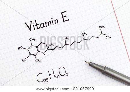 Chemical Formula Of Vitamin E With Black Pen.