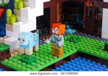 Tambov, Russian Federation - June 25, 2017 Lego Minecraft. Alex With Sheep Shears Catching To Shear 