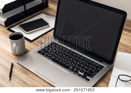 Wooden Desktop With Notebook