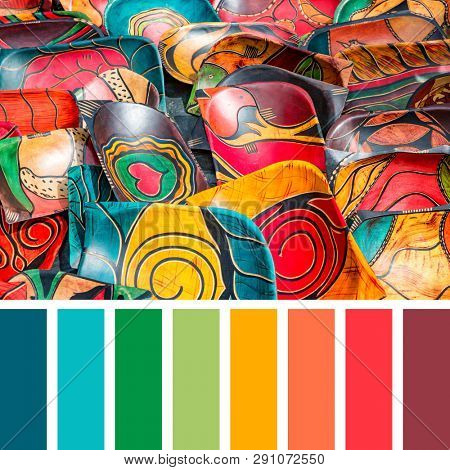 Decorative painted African carved wood bowls. In a colour palette with complimentary colour swatches. These bowls are generic and of the kind found at souvenir stalls across Africa